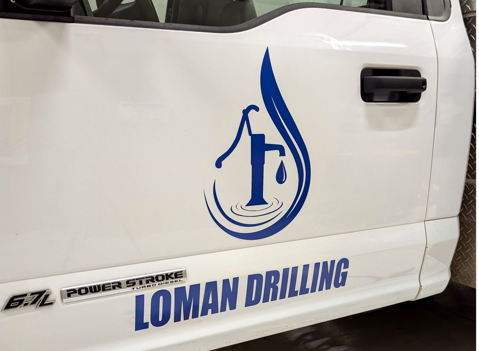 Custom door lettering and graphics on Loman Drilling pickup, Shawnee OK